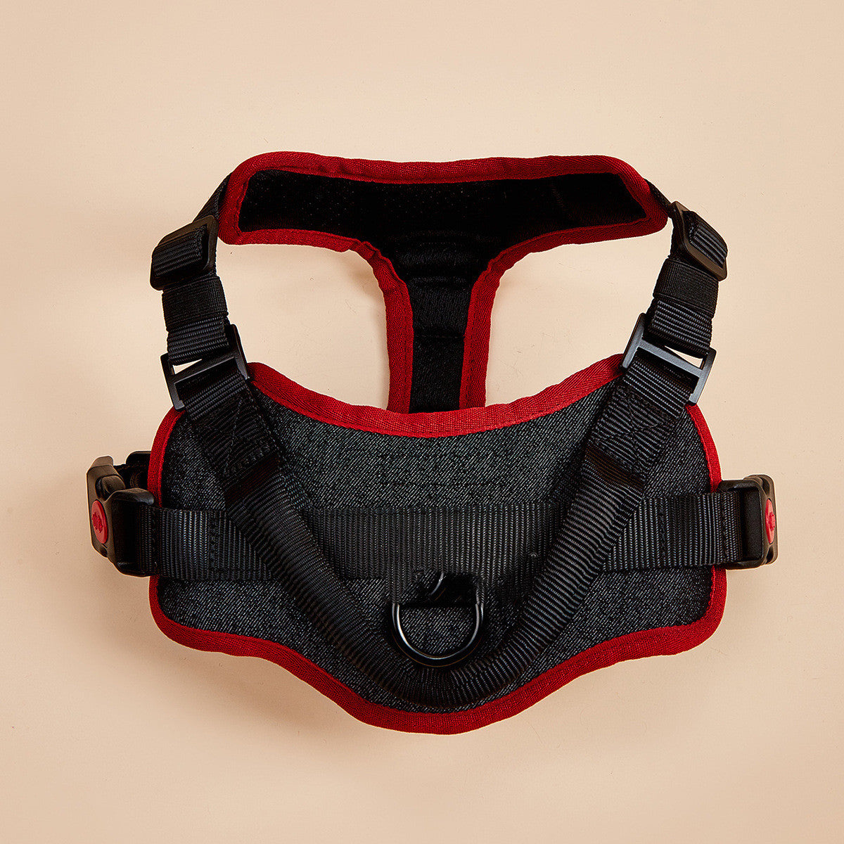 Black padded dog harness with red trim, grab handle and quick-release buckles